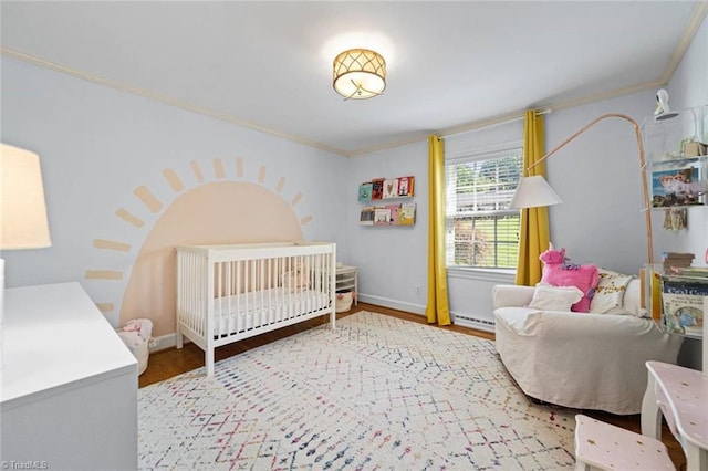 948 Kenleigh Cir, Winston-Salem, NC 27106 - bedroom featuring crown molding, wood finished floors, and baseboard heating