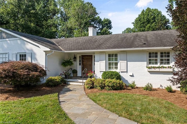 948 Kenleigh Cir, Winston-Salem, NC 27106 - single story home featuring a chimney, brick siding, and a front lawn