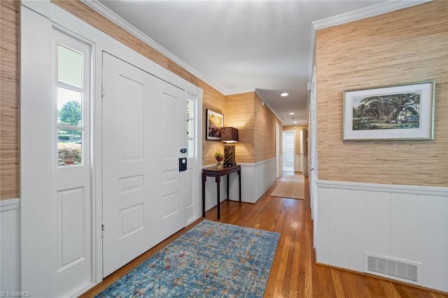 948 Kenleigh Cir, Winston-Salem, NC 27106 - entryway featuring a wainscoted wall, ornamental molding, wood finished floors, and recessed lighting