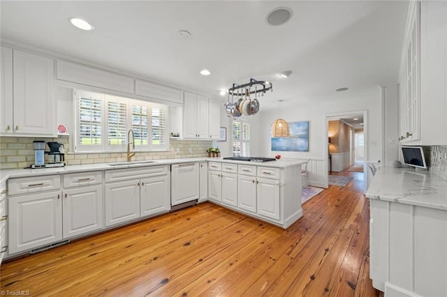 948 Kenleigh Cir, Winston-Salem, NC 27106 - kitchen featuring white dishwasher, a peninsula, white cabinetry, light wood-style floors, and recessed lighting