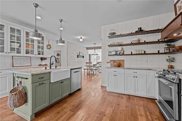 4420 Bunton Swaim Rd, Liberty, NC 27298 - kitchen with light wood-type flooring, a sink, stainless steel appliances, white cabinets, and green cabinetry