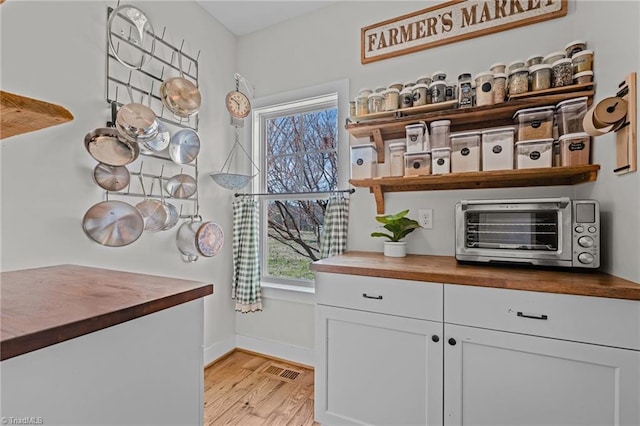 4420 Bunton Swaim Rd, Liberty, NC 27298 - interior space featuring a toaster, light wood-style floors, visible vents, and baseboards