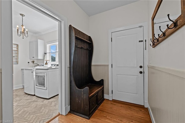 4420 Bunton Swaim Rd, Liberty, NC 27298 - mudroom with a wainscoted wall, washing machine and clothes dryer, crown molding, parquet floors, and a chandelier