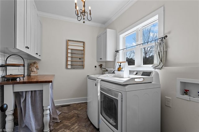 4420 Bunton Swaim Rd, Liberty, NC 27298 - clothes washing area with crown molding, baseboards, a notable chandelier, cabinet space, and independent washer and dryer