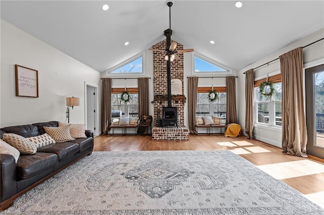 4420 Bunton Swaim Rd, Liberty, NC 27298 - living area with recessed lighting, high vaulted ceiling, a wood stove, and wood finished floors