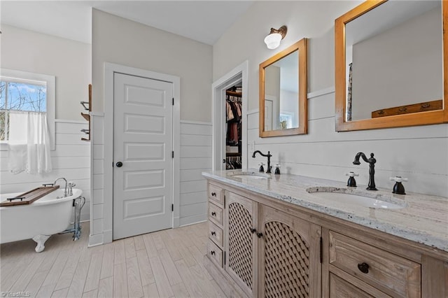 4420 Bunton Swaim Rd, Liberty, NC 27298 - bathroom featuring a sink, wood finished floors, and wainscoting