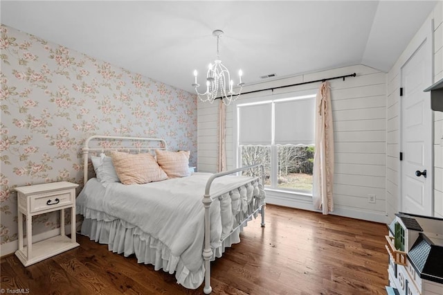4420 Bunton Swaim Rd, Liberty, NC 27298 - bedroom with visible vents, wood finished floors, wallpapered walls, a chandelier, and vaulted ceiling