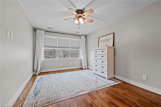 4420 Bunton Swaim Rd, Liberty, NC 27298 - unfurnished bedroom featuring visible vents, wood finished floors, and baseboards