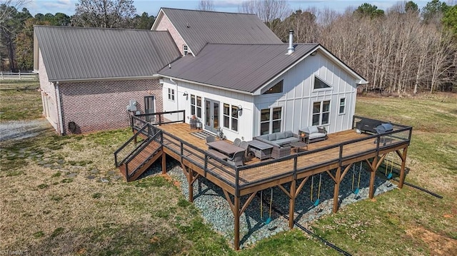 4420 Bunton Swaim Rd, Liberty, NC 27298 - rear view of property with an outdoor hangout area, a wooden deck, a yard, and metal roof
