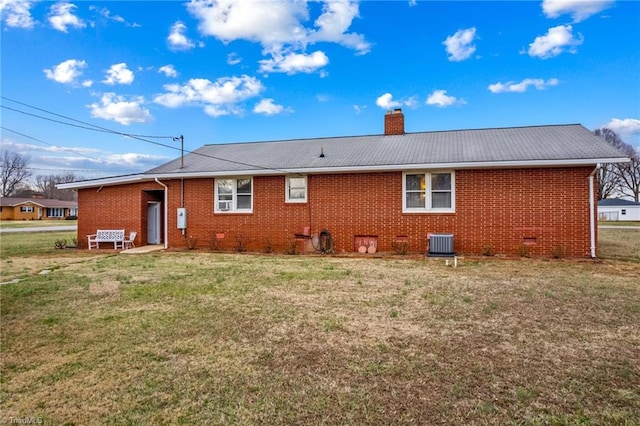 back of property with a yard and cooling unit