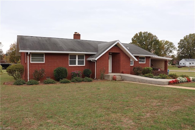 ranch-style home featuring a front yard