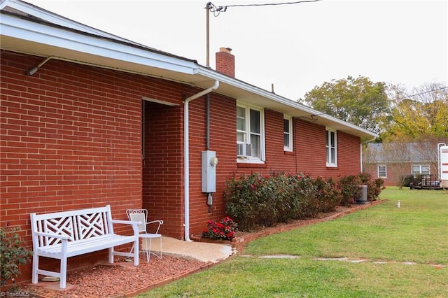 view of property exterior featuring a lawn