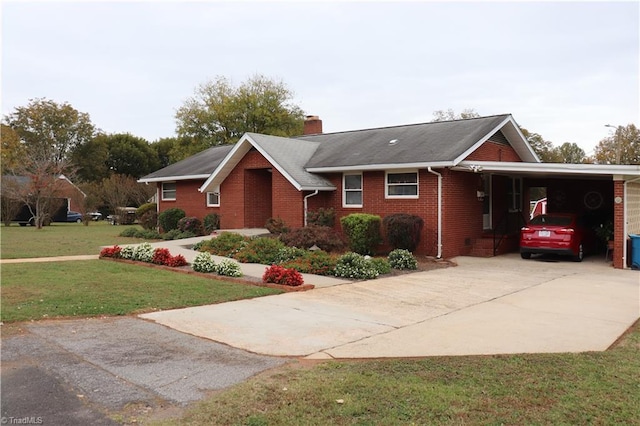 view of front of house featuring a carport and a front lawn