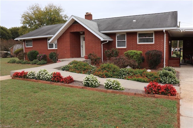 view of front facade featuring a front lawn and a carport