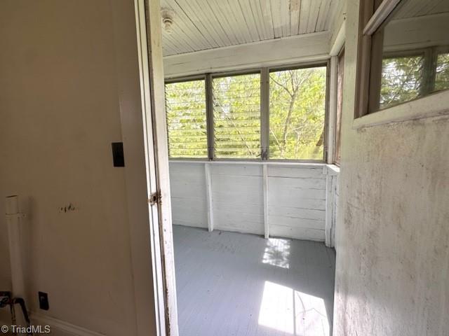 unfurnished sunroom featuring plenty of natural light
