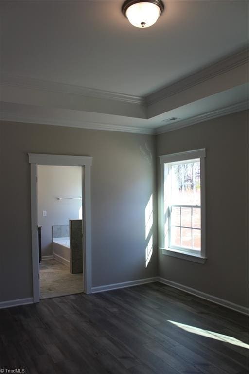 unfurnished room with dark hardwood / wood-style floors and ornamental molding