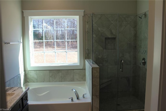 bathroom with plus walk in shower and vanity