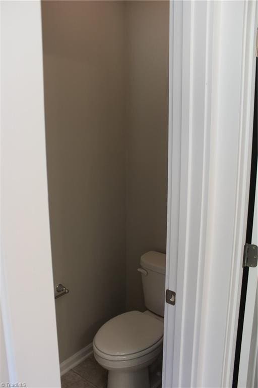 bathroom featuring toilet and tile patterned floors