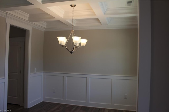 empty room featuring a notable chandelier, beam ceiling, and crown molding