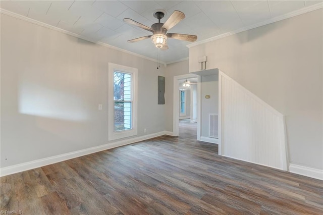 unfurnished room with dark hardwood / wood-style floors, ceiling fan, crown molding, and electric panel