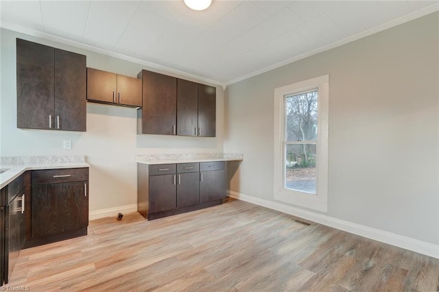 kitchen featuring dark brown cabinetry, light hardwood / wood-style flooring, and ornamental molding