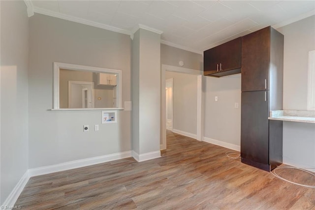 interior space with wood-type flooring and crown molding