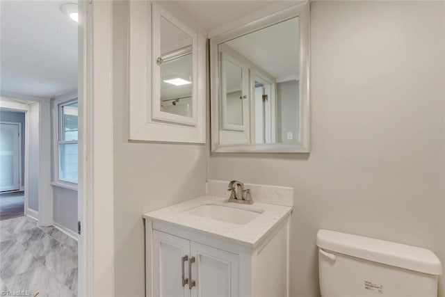 bathroom featuring vanity and toilet