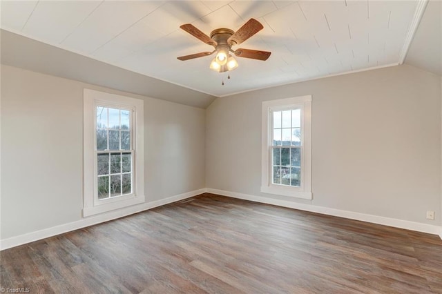 unfurnished room featuring ceiling fan, a healthy amount of sunlight, lofted ceiling, and crown molding