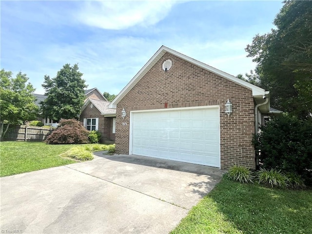104 Autumn Hill Ct, Archdale, NC 27263 - view of front of house with brick siding, driveway, and an attached garage