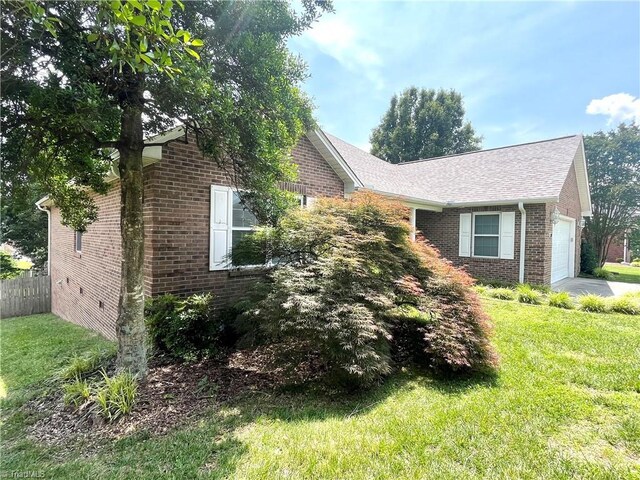 104 Autumn Hill Ct, Archdale, NC 27263 - view of home's exterior featuring brick siding and an attached garage