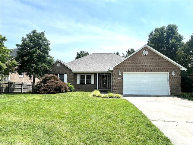 104 Autumn Hill Ct, Archdale, NC 27263 - view of front of house with an attached garage, brick siding, and driveway