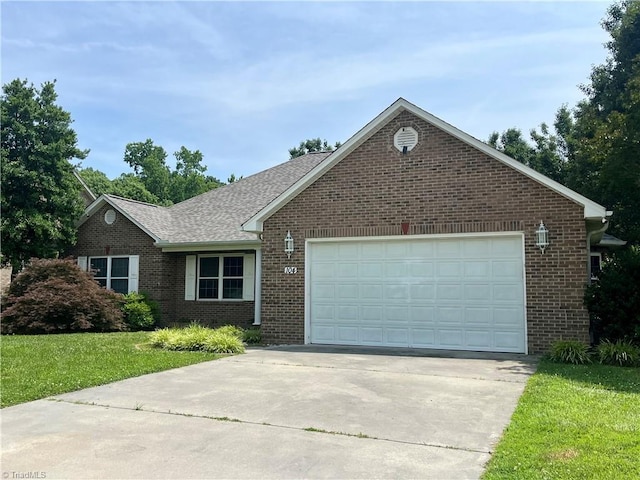 104 Autumn Hill Ct, Archdale, NC 27263 - ranch-style house featuring brick siding, driveway, an attached garage, and a front yard