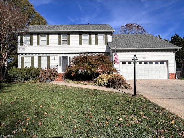 view of front of house featuring a front lawn and a garage