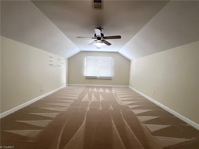 additional living space featuring carpet flooring, ceiling fan, and lofted ceiling