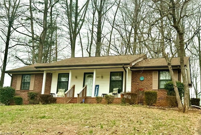 5687 Bull Run Rd, Winston-Salem, NC 27106 - single story home featuring a porch, brick siding, and a front lawn