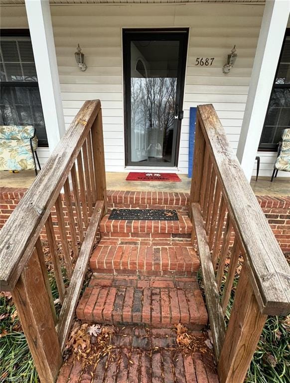 5687 Bull Run Rd, Winston-Salem, NC 27106 - property entrance with a porch