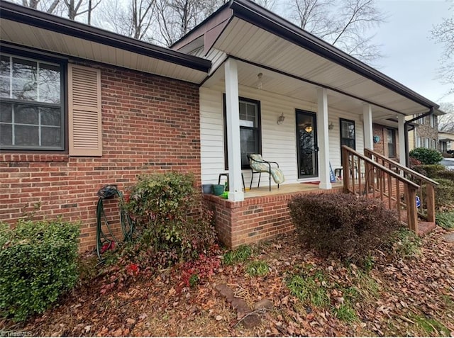 5687 Bull Run Rd, Winston-Salem, NC 27106 - view of exterior entry with brick siding and a porch