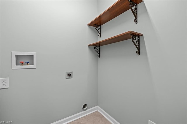 washroom with electric dryer hookup, hookup for a washing machine, and light tile patterned flooring