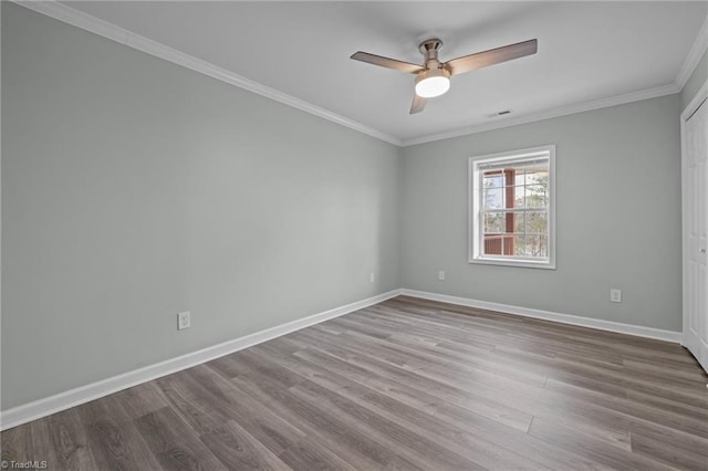 unfurnished room with ceiling fan, ornamental molding, and light hardwood / wood-style flooring