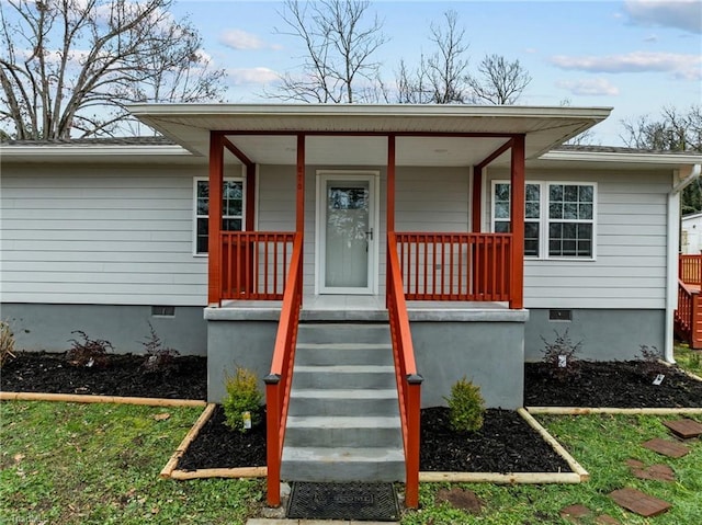 entrance to property featuring covered porch