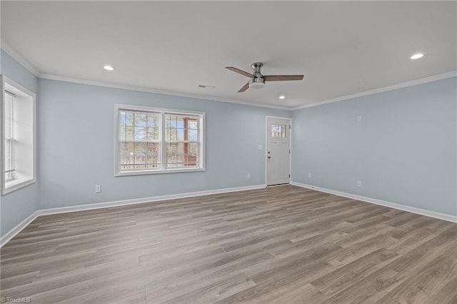 unfurnished room featuring light wood-type flooring, ceiling fan, and ornamental molding