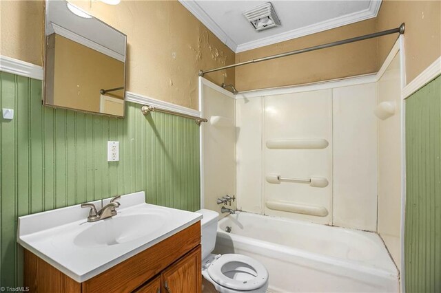 full bathroom featuring washtub / shower combination, vanity, toilet, and crown molding