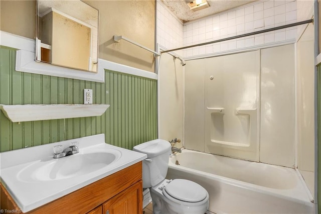 full bathroom featuring  shower combination, vanity, and toilet