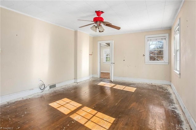 unfurnished room featuring wood-type flooring, ornamental molding, and ceiling fan