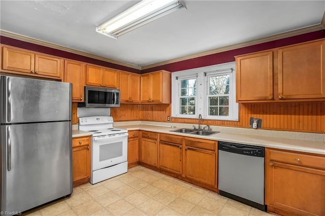 kitchen with sink, stainless steel appliances, and crown molding