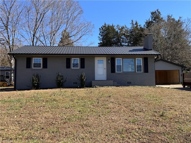 ranch-style house with brick siding, a chimney, a front yard, crawl space, and metal roof