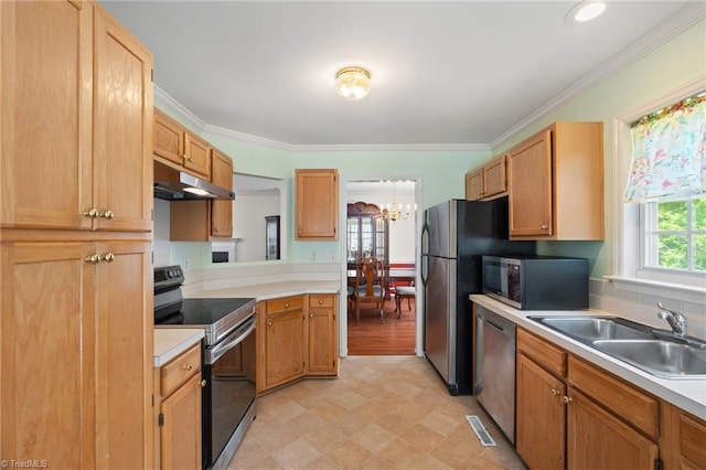 kitchen featuring light countertops, under cabinet range hood, a chandelier, a sink, and appliances with stainless steel finishes