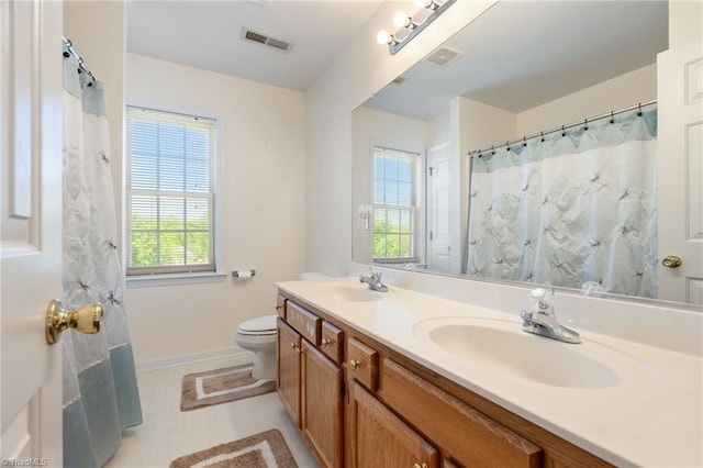 full bathroom featuring visible vents, a sink, baseboards, and toilet
