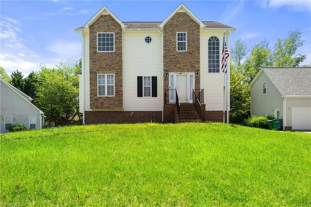 view of front of house with a garage, a front lawn, and stone siding