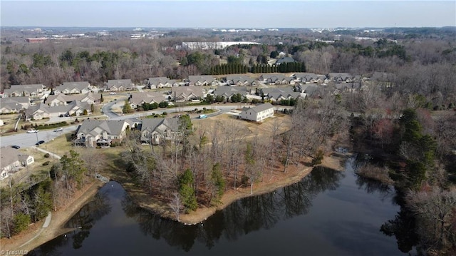 drone / aerial view with a residential view and a water view